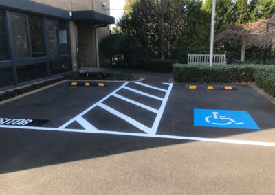 Car park and disabled pay car park line marking and wheel stops